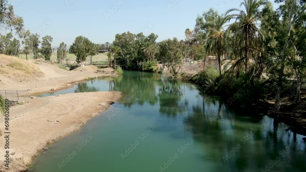 Low aerial drone flight over the Jordan River near Tiberias, Israel. Low aerial drone flight over the Jordan River near Tiberias, Israel.