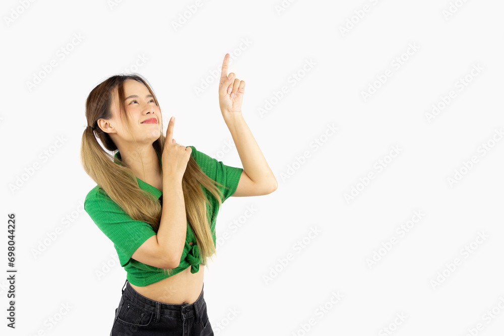 Young asian woman long hair style in gree shirt fingers pointing up isolated on white plain background. Young asian woman long hair style in gree shirt fingers pointing up isolated on white plain background.