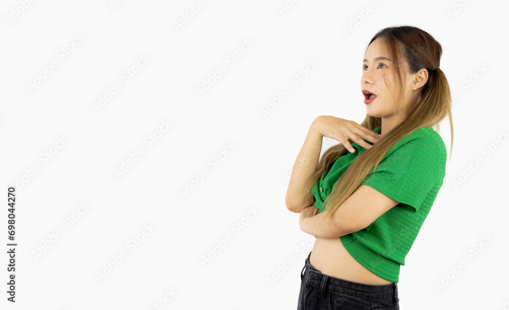 Young asian college girl in green shirt posing surprised face emotional isolated on white background. Young asian college girl in green shirt posing surprised face emotional isolated on white background.