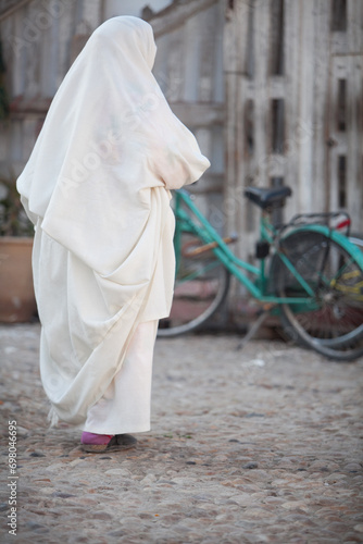 Woman walking on moroccan street Photos 