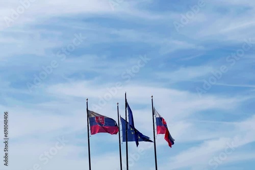 Cztery flagi na masztach - Słowacja i Unia Europejska photo