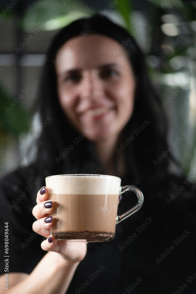 Barista's Hand Holding Crafted Mocha Delight Barista's Hand Holding Crafted Mocha Delight