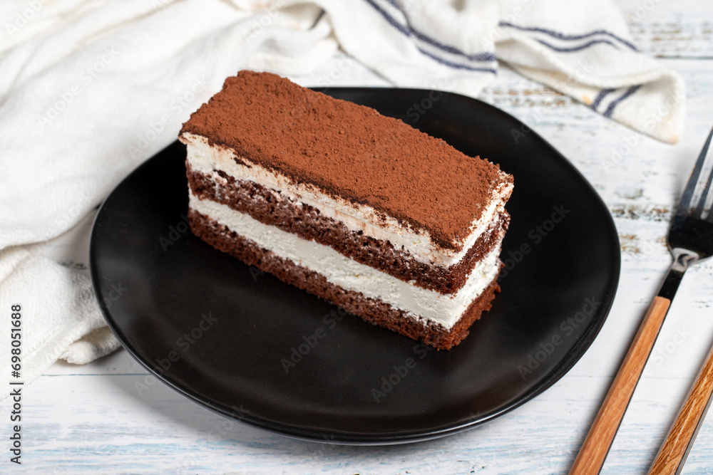 Tiramisu cake. Perfect homemade tiramisu cake on wooden background Tiramisu cake. Perfect homemade tiramisu cake on wooden background