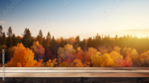 Wood table in autumn sunset landscape Wooden table