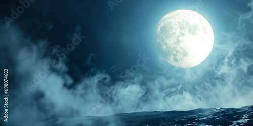 Spooky night cliff - Full moon casting it's moonlight on a empty stone cliff - with empty space for text - Spooky horror night scene - ethereal mist - foggy and smokey  photo