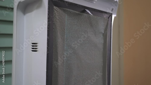 Close up view of the dust on the Hepa filter of the air purifier. photo