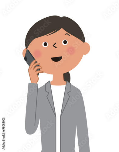 スマホで会話するスーツの女性