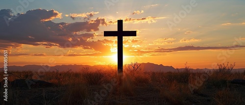 Tela Silhouette of a cross on the background of a bright sunset