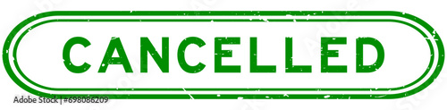 Grunge green cancelled word rubber seal stamp on white background