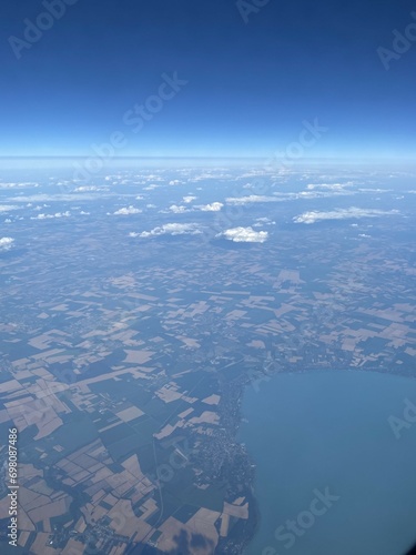 view from plane over europe blue sky © Józef