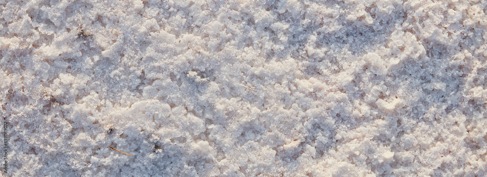 Natural salt Close up. Surface of a salt lake. Natural background. Natural formations of Salt crystals. Top view on Pink salt lake Natural salt Close up. Surface of a salt lake. Natural background. Natural formations of Salt crystals. Top view on Pink salt lake