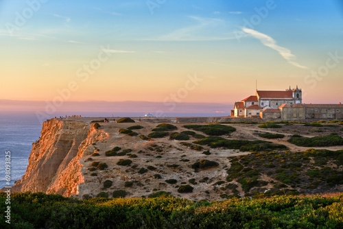 Obraz na płótnie Old monastery on high cliff over seascape at sunset, Portugal w salonie