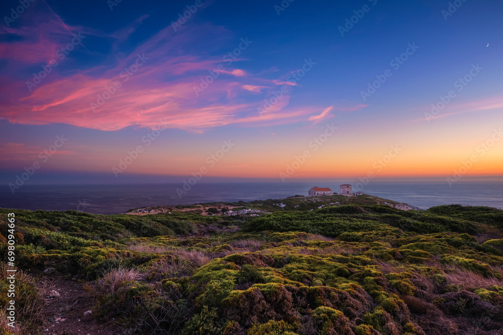 Colorful landscape of cape Espichel coast at sunset, Portugal