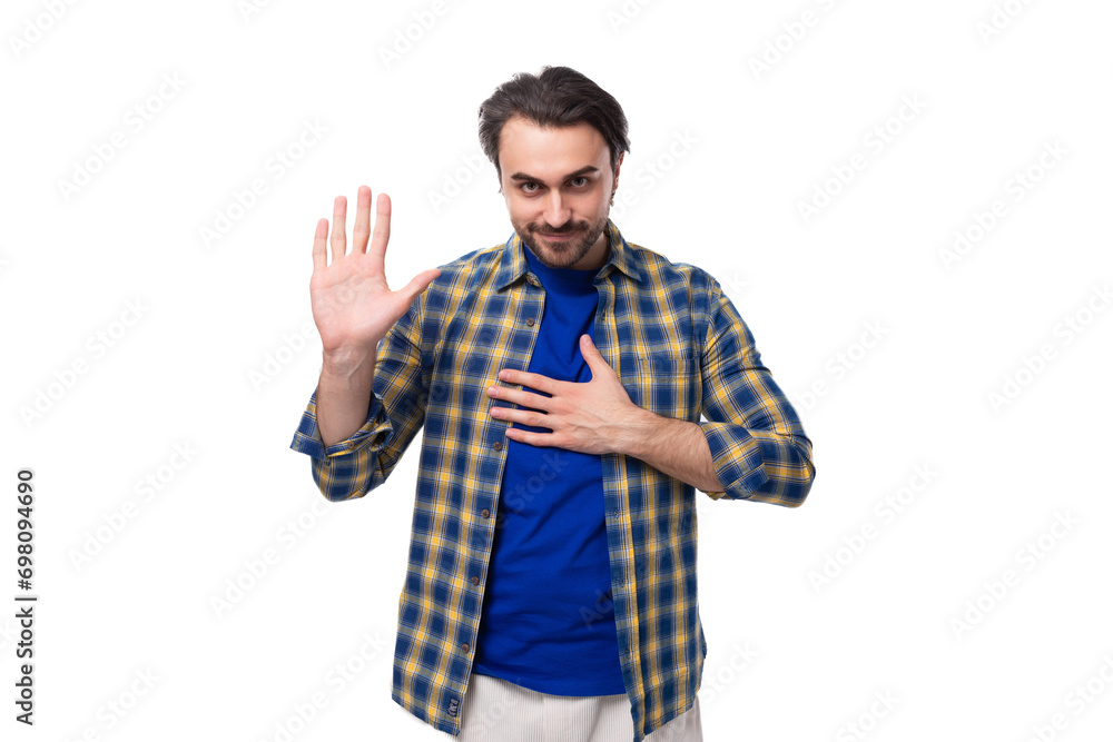 young caucasian brutal man with unshaven face dressed in a plaid stylish shirt young caucasian brutal man with unshaven face dressed in a plaid stylish shirt