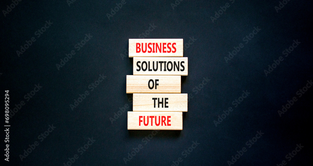 Business solutions of the future symbol. Concept words Business solutions of the future on wooden blocks. Beautiful black table black background. Business solutions of the future concept. Copy space. Business solutions of the future symbol. Concept words Business solutions of the future on wooden blocks. Beautiful black table black background. Business solutions of the future concept. Copy space.