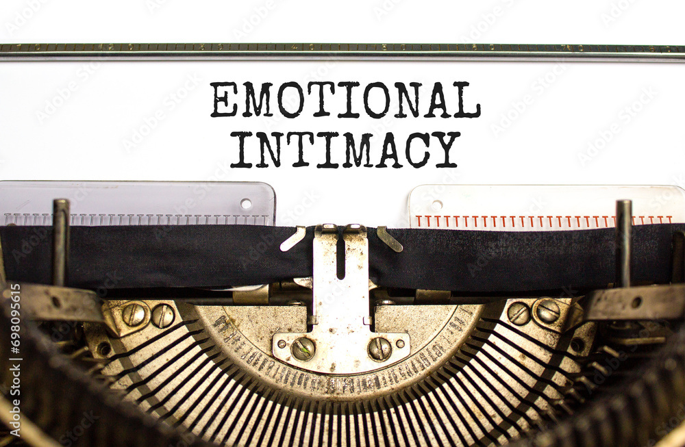 Emotional intimacy symbol. Concept words Emotional intimacy typed on beautiful old retro typewriter. Beautiful white paper background. Psychology emotional intimacy concept. Copy space.
