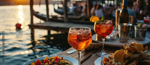 Italian Venetian small bites and Spritz cocktails by the dock at happy hour. photo