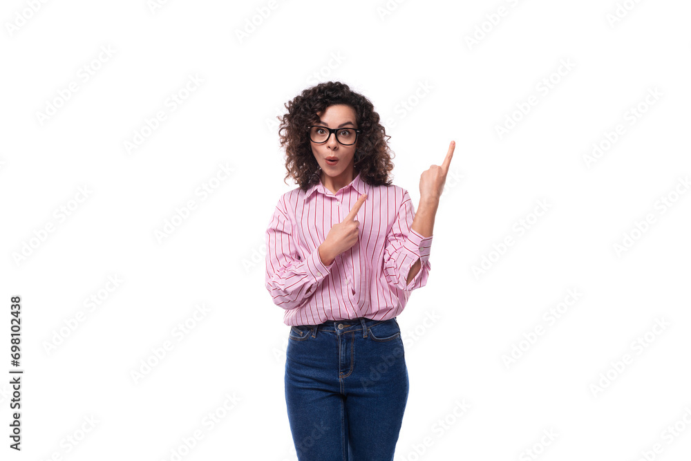 young surprised caucasian woman leader dressed in a striped shirt on the background with copy space young surprised caucasian woman leader dressed in a striped shirt on the background with copy space