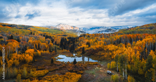 Epic Aerial Colorado Fall Season Vista Remote Wilderness Dispersed Camping Trailer. Dramatic Clouds Mountains Kebler Pass. photo