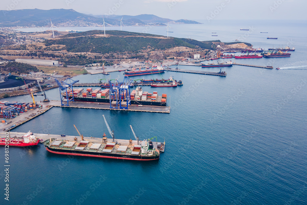 Cargo ship loading on Cargo bulk port terminal, port international trade and logistic. Aerial view