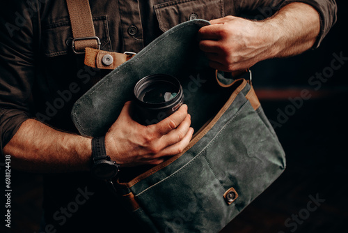 hipster man with stylish shoulder bag. lifestyle, fashion, style and people concept photo