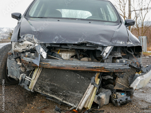Seriously damaged car near roadside after accident in Romania.