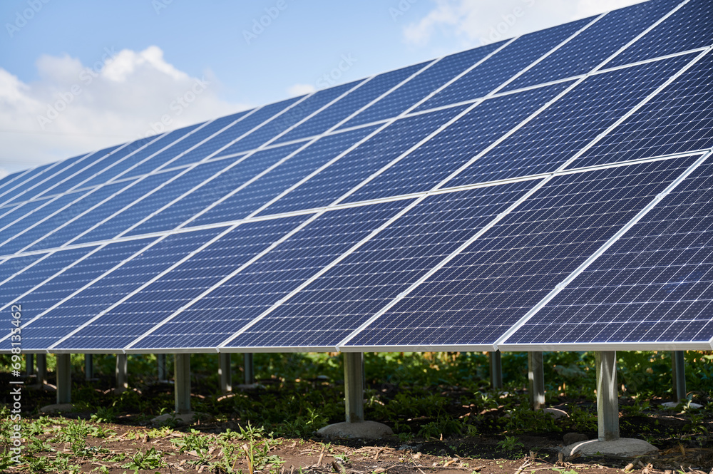 Solar system as modern lifestyle. Large photovoltaic panels working at sunny day. Saving nature with your own benefit. Solar system as modern lifestyle. Large photovoltaic panels working at sunny day. Saving nature with your own benefit.