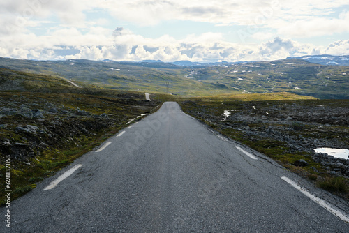 straight road to the mountains in norway