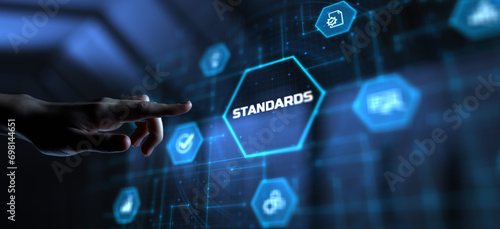 Standard standardization certification quality control assurance. Hand pressing button on virtual screen.