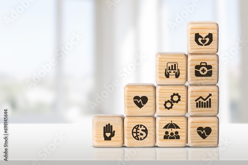 Employee benefits, hand hold wooden cubes photo