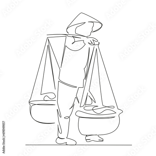 elderly Vietnamese woman carrying baskets