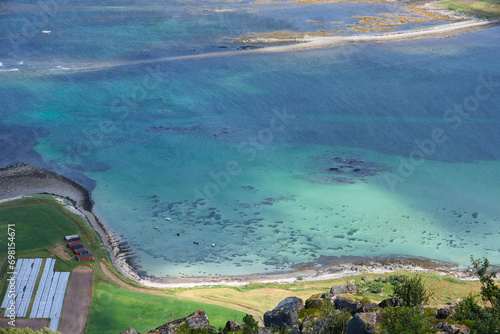 aerial view of beach and clear water in the lofoten