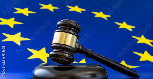 JUDGE GAVEL AND EUROPEAN FLAG. HUMAN RIGHTS IN THE COURT OF JUSTICE OF THE EUROPEAN UNION, CJEU.
