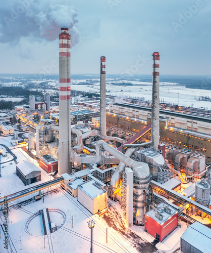 Coal power plant in winter produces electricity and heating for east bohemia households. Industrial landscape. photo