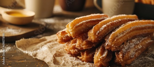 Churros are a popular sweet snack in Spain and Mexico, often eaten for breakfast or as a snack with hot beverages. photo