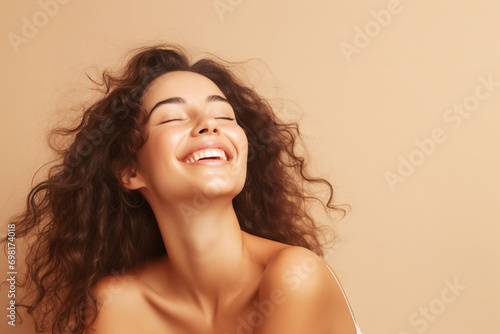 Wallpaper Mural portrait of a beautiful happy smiling young woman isolated on beige background. skin care beauty, skincare cosmetics concept Torontodigital.ca