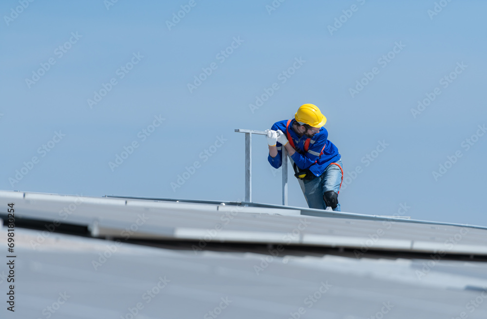 A new technician trainee working on solar panels with a fear of heights A new technician trainee working on solar panels with a fear of heights