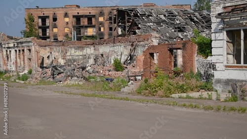 Trostianets, Sumy Oblast, Ukraine - June 18,2023: Bombed buildings and a town square overgrown with grass in Trostyanets a year after the liberation from occupation by Russian troops. Video 17 seconds photo