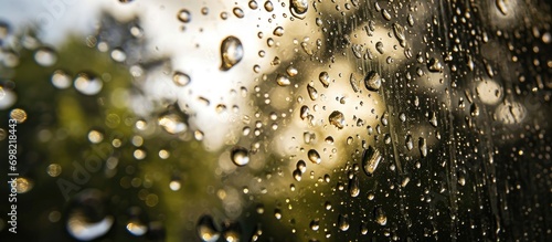 Water droplets on window form natural textured background.