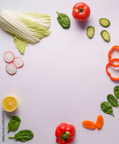 Flat lay of different vegetables on white background, copy space. Food concept.