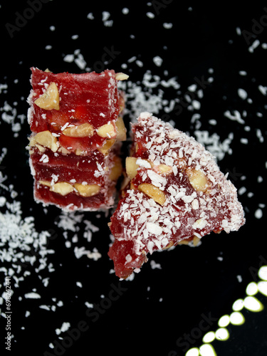 Turkish delight. Red Lokum with nuts and coconut flakes