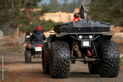 Traveling off-road. A group of tourists on moto-vehicles leaves a tourist base located in the mountains.