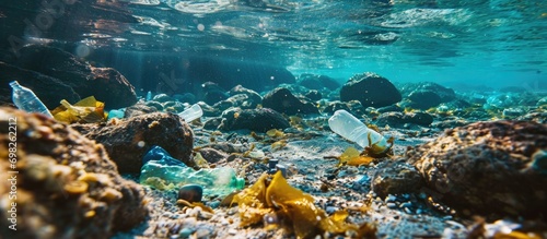 Ocean floor polluted with plastic waste, including bottles, bags, and debris in the Mediterranean Sea.