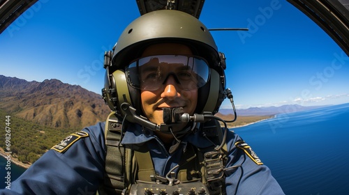 Selfie of an airplane pilot in the sky with a view of the mountains