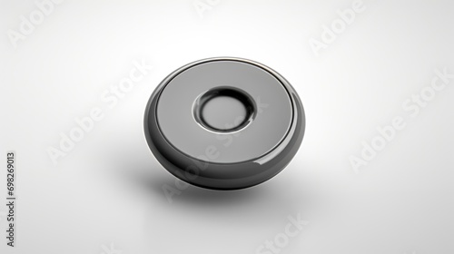  a metal object on a white surface with a black circle at the center of the object and a black circle at the bottom of the object.