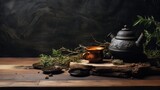  a tea pot sitting on top of a wooden table next to a bowl of tea and a cup of tea.
