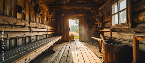 Traditional wooden sauna in Margionys village, Lithuania photo