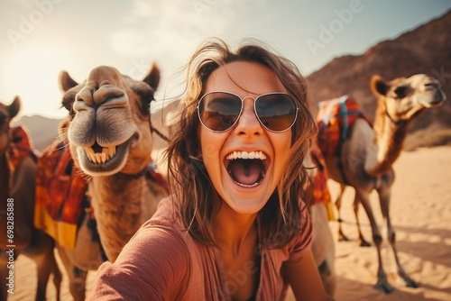 happy smiling young woman with camel in desert  © RJ.RJ. Wave