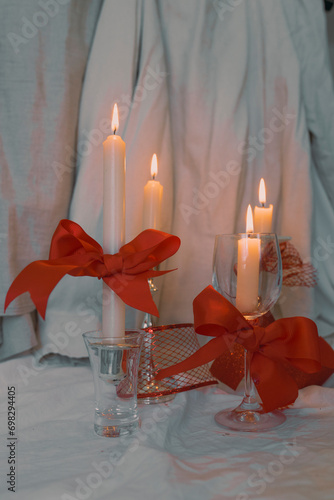 Christmas candle trend with red ribbons and cinematic style