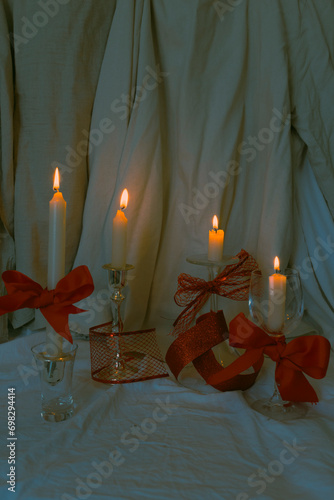 Christmas candle trend with red ribbons and cinematic dark style
